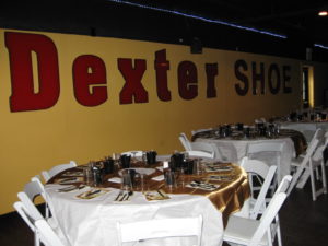 Dexter Shoe sign with decorated table settings at event