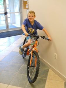 young boy on bicycle