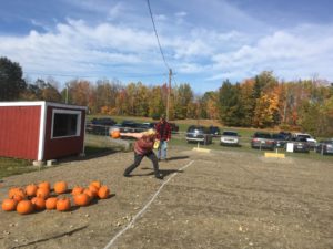 woman throwing pumpkin