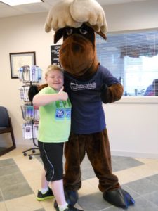 young boy posing with Monty Moose