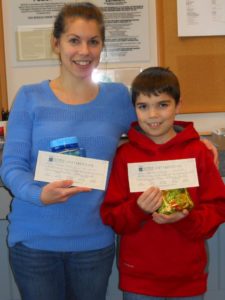 mother and son showing off their winning prizes