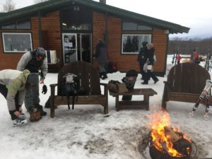 skiiers going into ski lodge at end of day