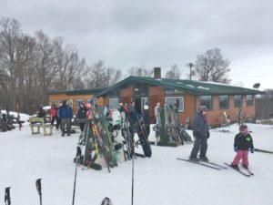 skiiers in front of ski lodge