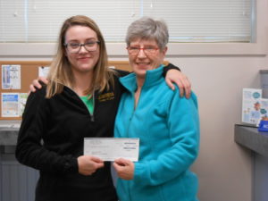 employee presenting check to a member