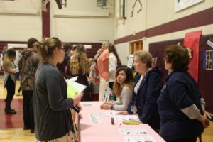 students at one of the booths of the financial fitness fair