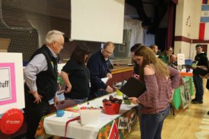 students at one of the booths of the financial fitness fair