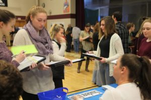 students at one of the booths of the financial fitness fair