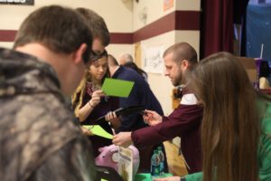 students at one of the booths of the financial fitness fair