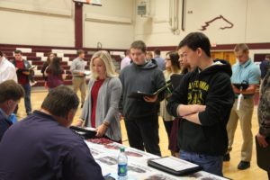 students at one of the booths of the financial fitness fair