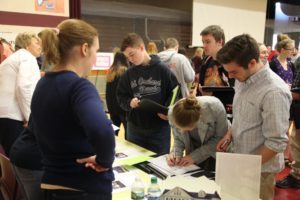students at one of the booths of the financial fitness fair