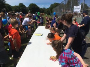 group of people watching pie eating contest