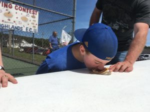 boy eating pie without using hands