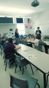 classroom of students participating in session