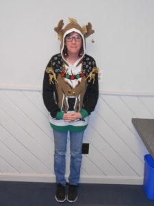 employee in ugly Christmas sweater