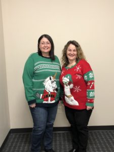 employees in ugly Christmas sweaters