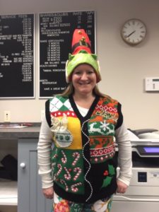 employee in ugly Christmas sweater