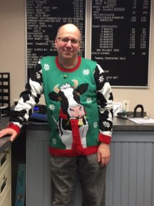 employee in ugly Christmas sweater