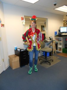 employee in ugly Christmas sweater