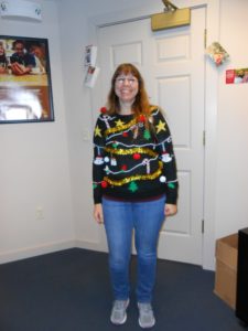 employee in ugly Christmas sweater
