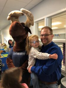 father and daughter enjoying the day with Monty Moose