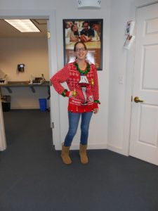 employee in ugly Christmas sweater