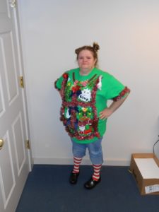 employee in ugly Christmas sweater