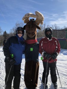 Monty Moose with skiiers