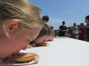 child eating pie