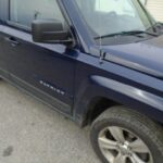 Blue Jeep Passenger's Side