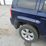 Blue Jeep Passenger's Side