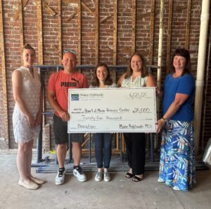 MHFCU presents donation to Heart of Maine Resource Center