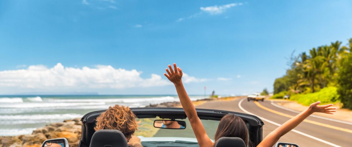 People driving near ocean